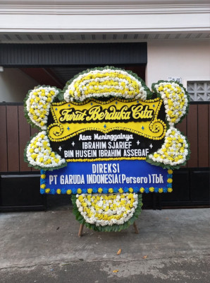 Papan Bunga Duka di Kombi